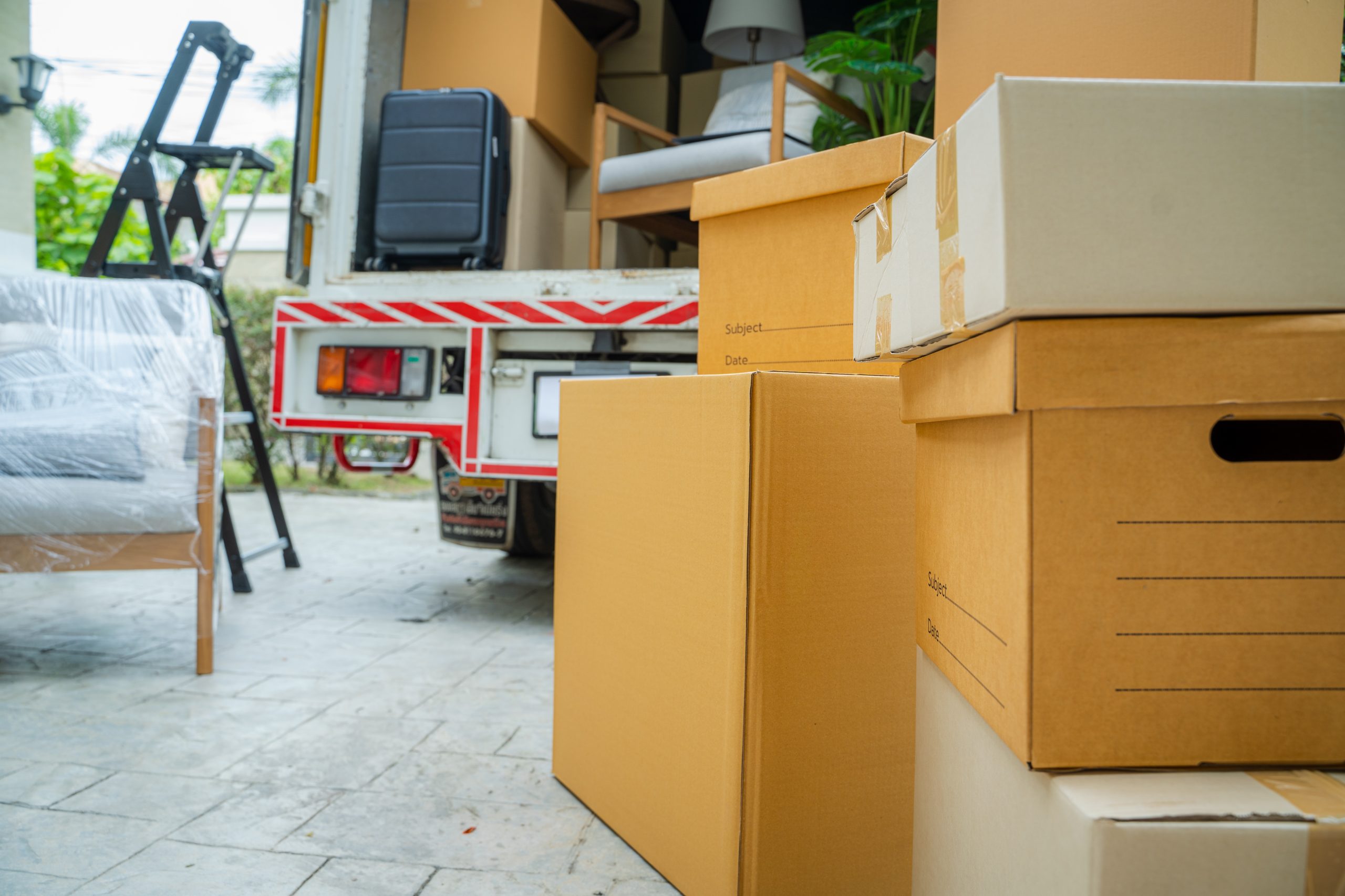 Expert Removals A moving truck full of boxes and furniture.