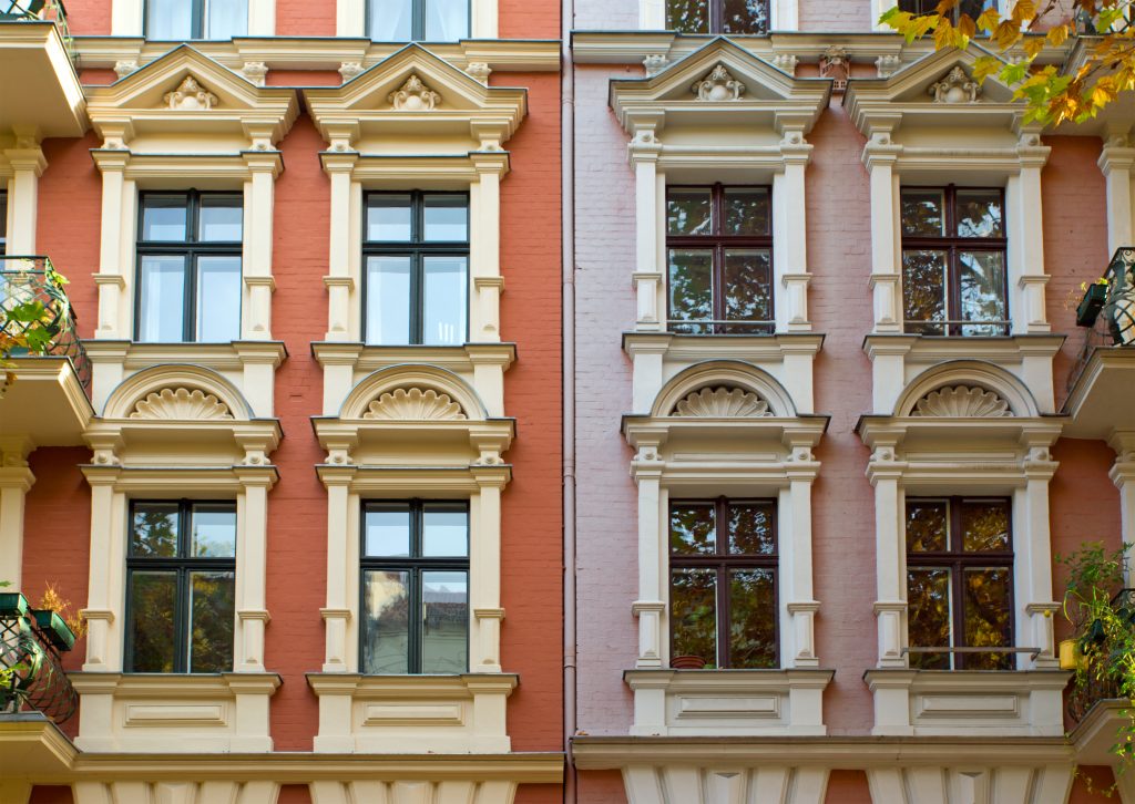 Expert Removals A row of buildings with windows and balconies.